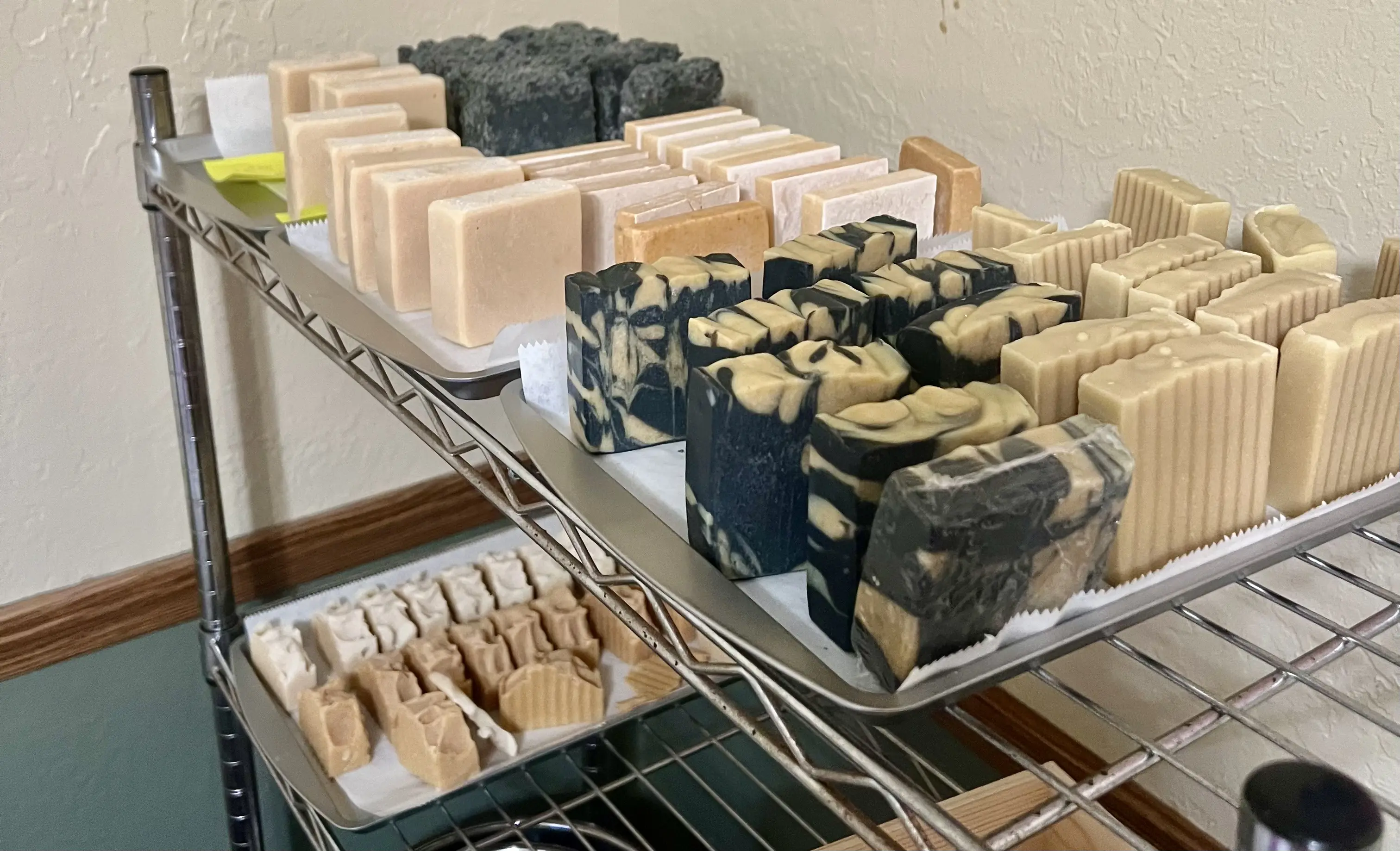 Additional handcrafted Suds PRN soaps curing during production